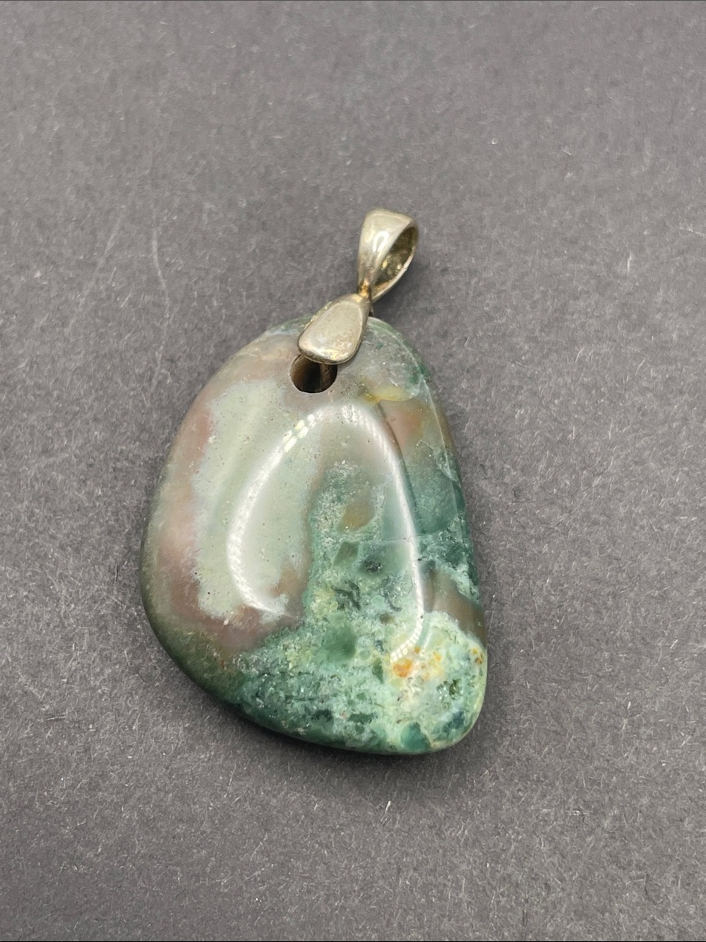 Blood stone pendant with silver tone bale